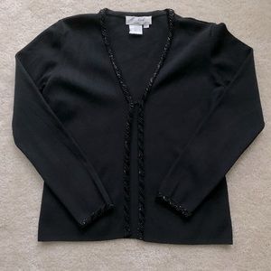 Sweater with sequins on front and cuffs.